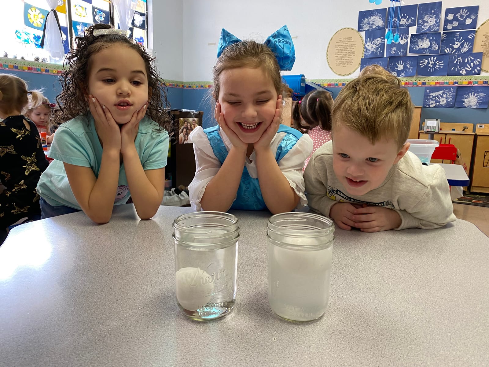 Preschoolers exploring a hands-on science activity at Cactus Wren